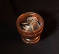 Wooden cup of coins Royalty Free Stock Photo