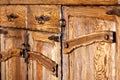 Wooden cupboard doors with forged metal handles Royalty Free Stock Photo