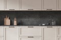 Wooden cupboards in dark gray kitchen interior Royalty Free Stock Photo