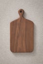 Wooden cutting board. Wooden chopping board. Walnut handmade wood cutting board on the linen.
