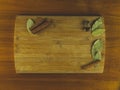 Wooden cutting board with cinnamon, nutmeg and bay leaf Royalty Free Stock Photo