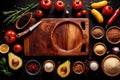 Wooden cutting board with food cooking ingredients, herbs and spices, cuisine concept