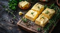 A wooden cutting board with four squares of butter and herbs, AI