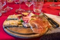 Wooden cutting board with meats, cheeses ,breads and salad at a wine tasting at a winery Royalty Free Stock Photo