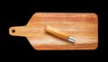 Wooden cutting board and pocket knife isolated on black Royalty Free Stock Photo