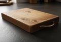 A wooden cutting board with a rectangular shape and rounded Royalty Free Stock Photo