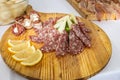 Wooden cutting board with samples of Italian cold cuts and cheeses Royalty Free Stock Photo