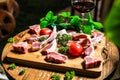 Wooden Cutting Board With Assorted Meats and Vegetables Royalty Free Stock Photo
