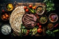 A wooden cutting board with sliced beef, surrounded by various ingredients for fajitas, including tortillas, salsa, guacamole, and