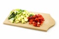 Wooden cutting board with various cut vegetables Royalty Free Stock Photo