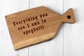 Wooden cutting board with wise inscription about food