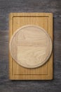 Wooden cutting boards on the kitchen table, multifunctional wooden cutting boards for cutting bread, pizza, Royalty Free Stock Photo