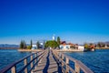 Wooden deck leading to the Saint Nikolas monastery in Porto Lagos. Royalty Free Stock Photo