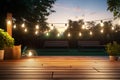 Wooden deck with suspended lights, inviting a path to the garden
