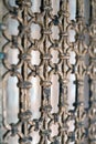 A wooden decoraive beautiful lattice on the doors of silver color. Background of decorative lattice in a shallow depth of field.