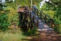 Wooden bridge over the stream in the forest, wooden decorative bridge for tourists Royalty Free Stock Photo