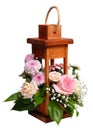 Wooden decorative lantern with flowers over white. Royalty Free Stock Photo