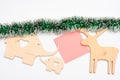 Wooden deer and elephant toys or decoration with paper for note on white background. Decorations for Christmas holidays Royalty Free Stock Photo