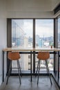 Wooden desk with chairs at corner modern office