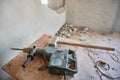 Electric drill and hammers on wooden table in apartment. Royalty Free Stock Photo