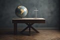 Wooden desk with a globe and a cross. Missionary work