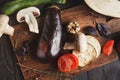 Wooden desk with vegetables on brown background Royalty Free Stock Photo