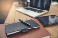 A wooden desk with a laptop, notebook,Home at work Royalty Free Stock Photo