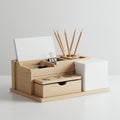 Wooden desk organizer featuring compartments for note cards, paper clips, and pencils. Royalty Free Stock Photo