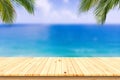 Wooden desk or plank on sand beach in summer. background. Royalty Free Stock Photo
