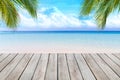 Wooden desk or plank on sand beach in summer. background. Royalty Free Stock Photo