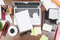 Wooden desk top with office items and devices Royalty Free Stock Photo