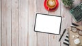 Wooden desk workplace with blank screen tablet, calculator, pen, eyeglass, notebook and cup of coffee, Royalty Free Stock Photo