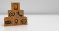Wooden dice with contact symbols and white background