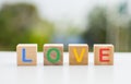 The wooden dice that line up form the word \'love\'. Royalty Free Stock Photo