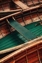 Wooden dinghy boats moored at pier at calm waters of Lake Bohinj, Slovenia Royalty Free Stock Photo