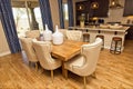 Dining Area With Wooden Table And Six Highback Chairs