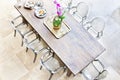 Wooden dining table above view with plastic chairs Royalty Free Stock Photo