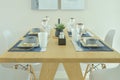 Wooden dining table with dining set in modern style Royalty Free Stock Photo