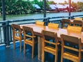 Wooden dining table set near the river Royalty Free Stock Photo