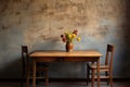 a wooden dining table with only two chairs, against a wall Royalty Free Stock Photo