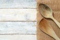 Wooden dipper kitchenware on a sack on a white wooden table Royalty Free Stock Photo