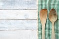 Wooden dipper kitchenware and on a table cloth on a white wooden table Royalty Free Stock Photo