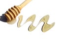 Wooden dipper with spilled honey on a white background.