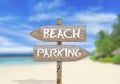 Wooden direction sign beach or parking