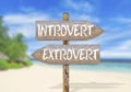 Wooden direction sign with introvert and extrovert