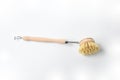 Wooden dish brush with bamboo wood and natural Bristle Tampico Fiber, on white background . Item for cleaning in kitchen