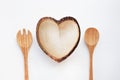 Wooden dish heart shape with spoon and fork
