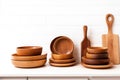 Assortment of wooden plates dishes kitchen utensils on wooden background Royalty Free Stock Photo