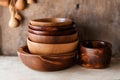 Assortment of wooden plates dishes kitchen utensils on wooden background Royalty Free Stock Photo