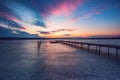 Wooden Dock and fishing boat at the lake, sunset shot Royalty Free Stock Photo